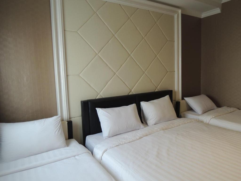 Postel nebo postele na pokoji v ubytování Hotel 55