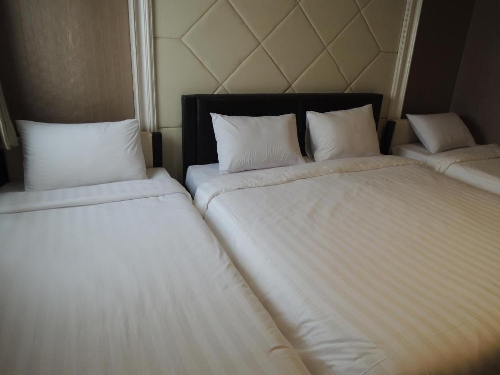 Postel nebo postele na pokoji v ubytování Hotel 55