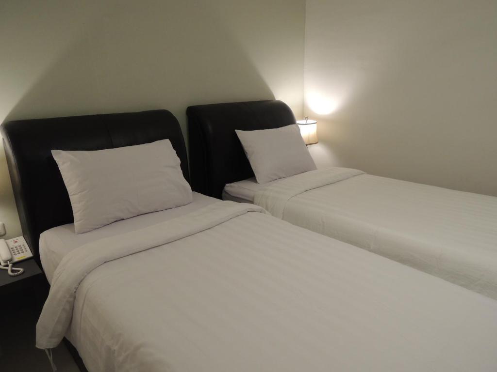 Postel nebo postele na pokoji v ubytování Hotel 55