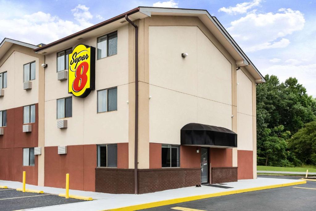 a building with a burger king sign on it at Super 8 by Wyndham Chester/Richmond Area in Chester