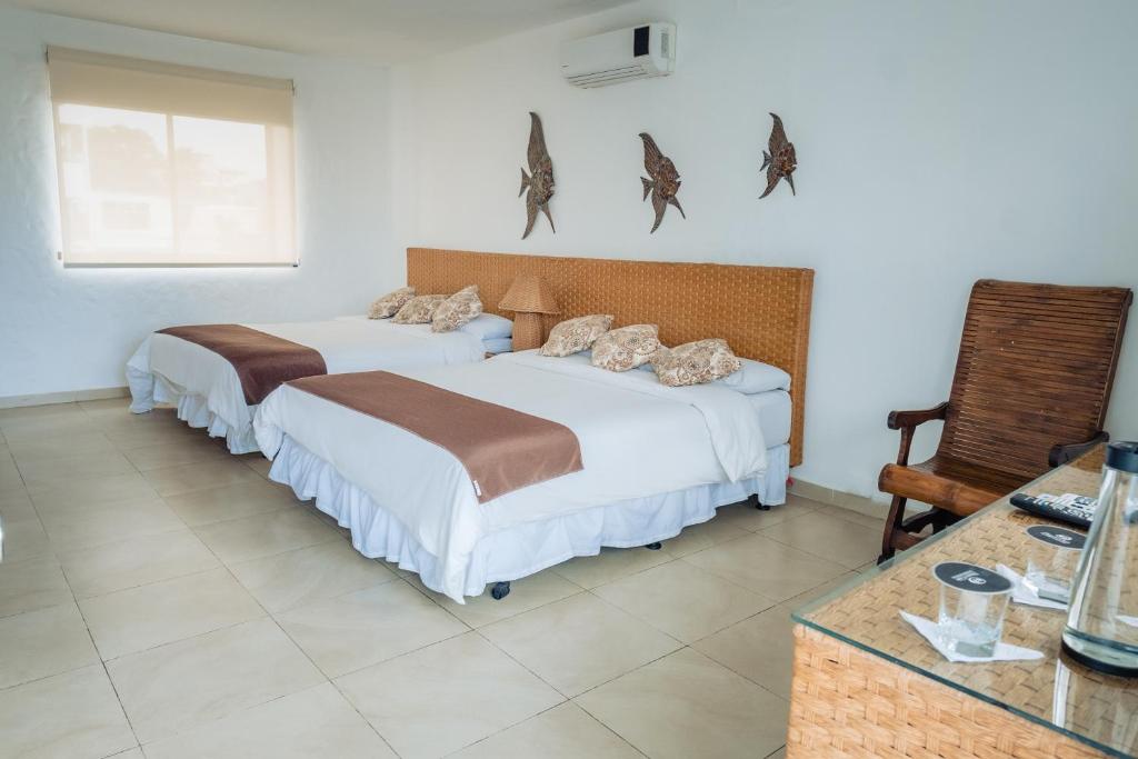 Postel nebo postele na pokoji v ubytování Hotel Vistalmar