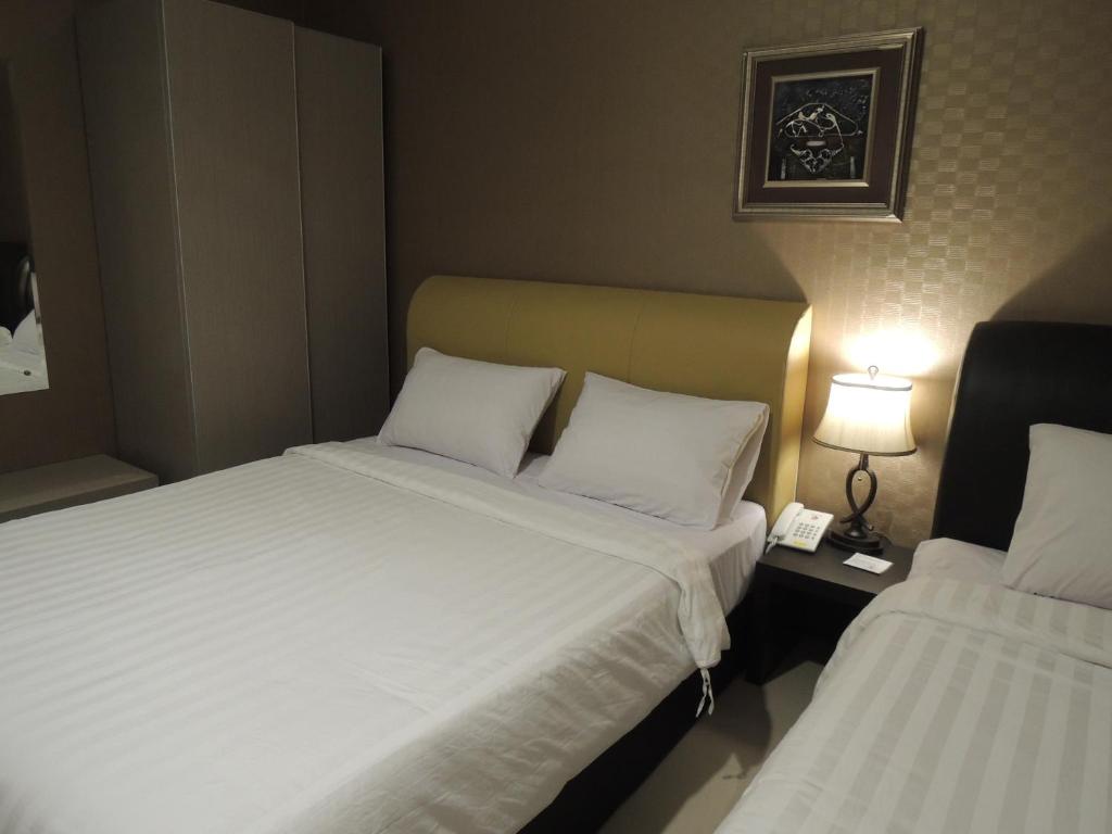 Postel nebo postele na pokoji v ubytování Hotel 55