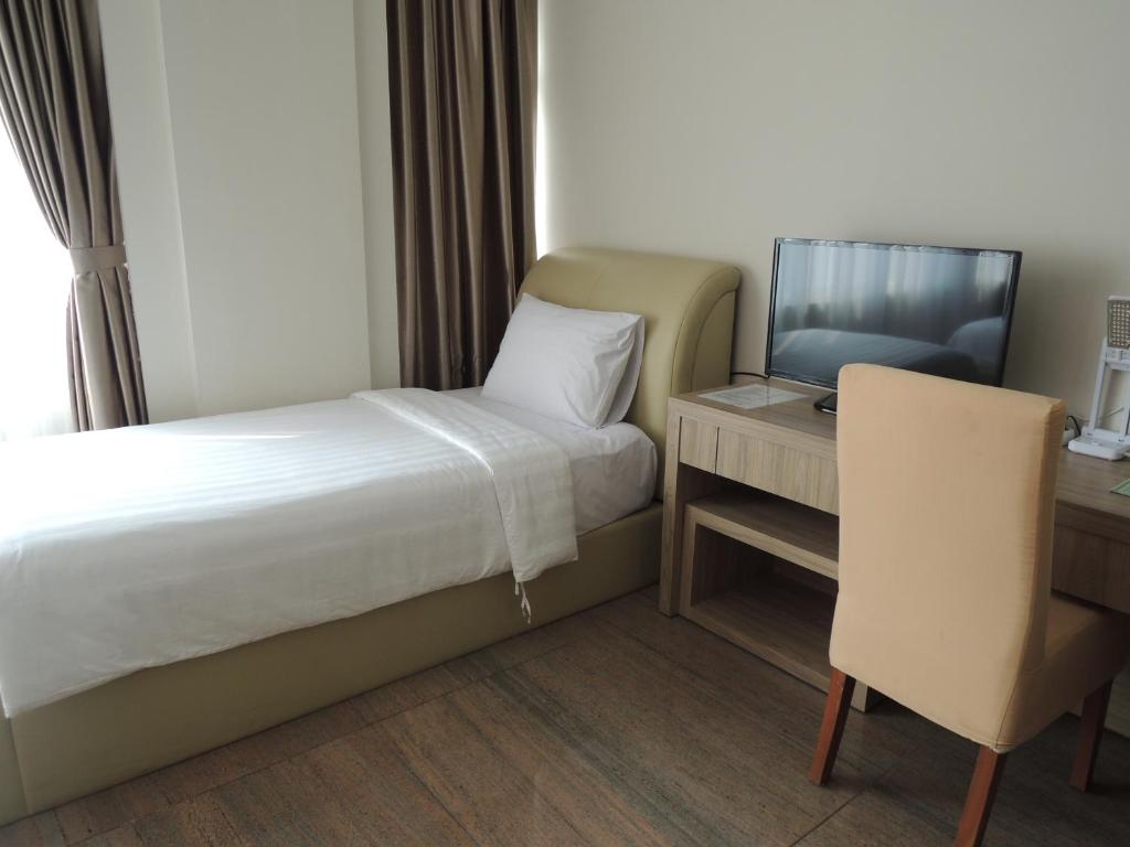 Postel nebo postele na pokoji v ubytování Hotel 55