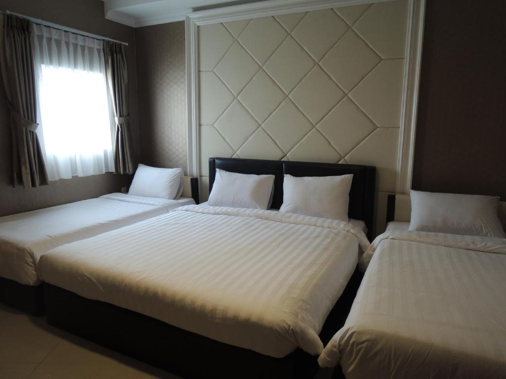 Postel nebo postele na pokoji v ubytování Hotel 55