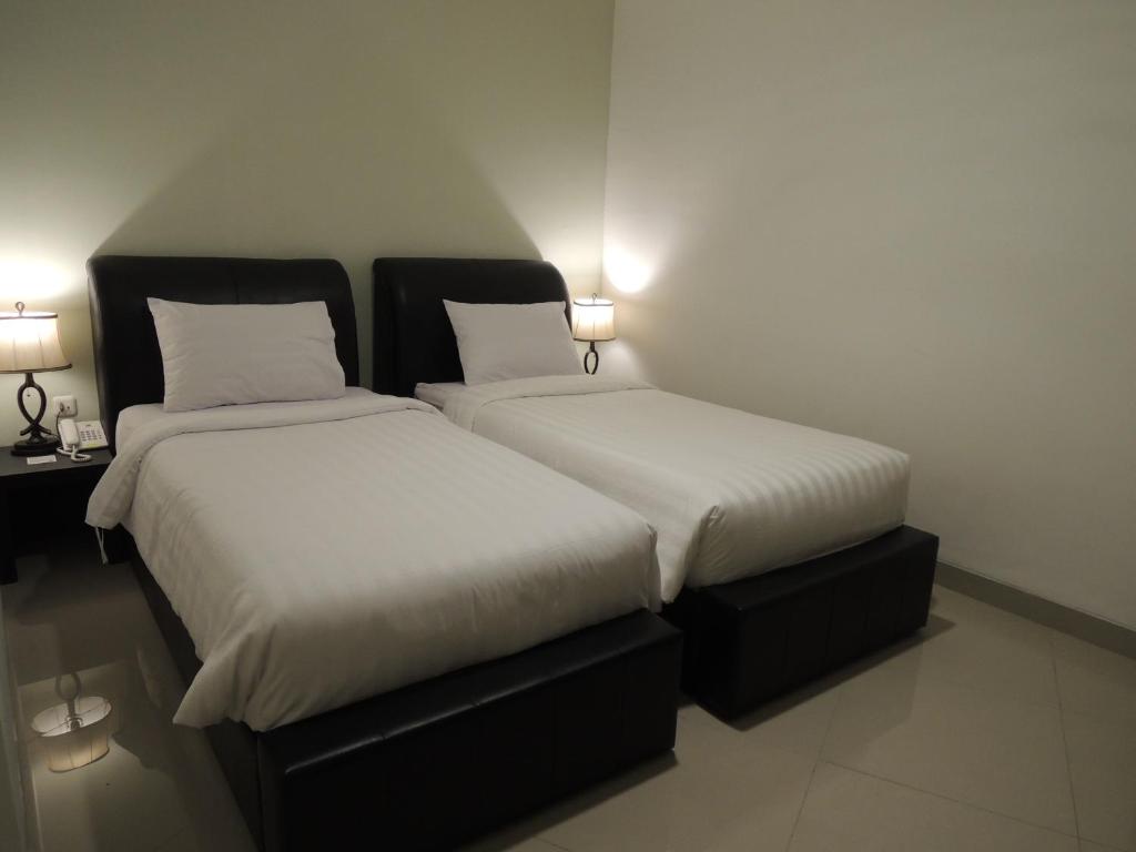 Postel nebo postele na pokoji v ubytování Hotel 55