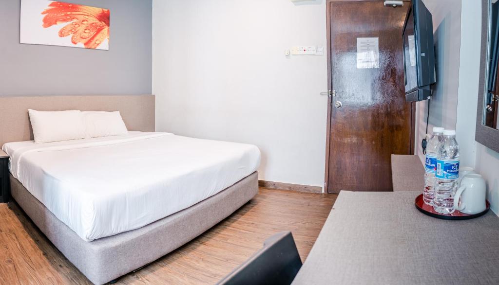 Postel nebo postele na pokoji v ubytování K West Hotel