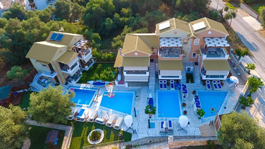 an aerial view of a house with a swimming pool at All Saints Villas in Plataria