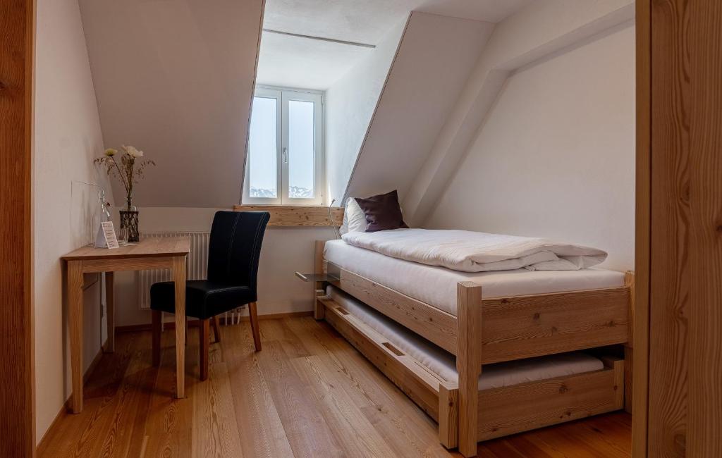 Postel nebo postele na pokoji v ubytování Hotel Belalp