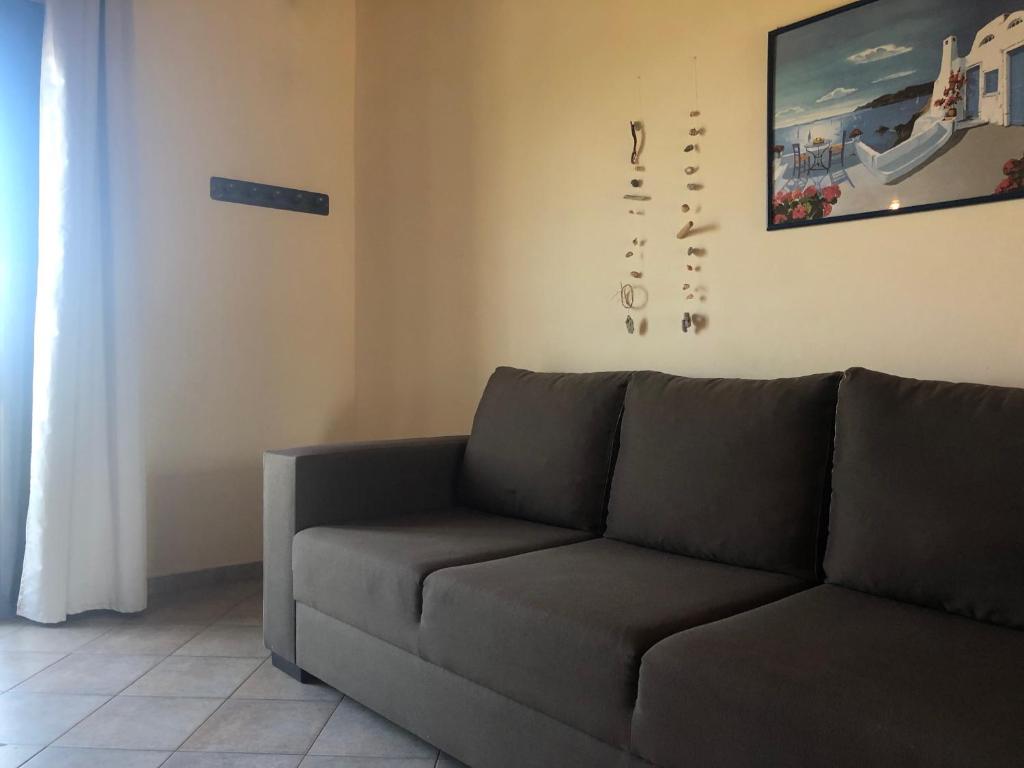 a living room with a couch in a room at Blue Sky in Frangokastello