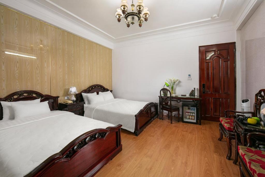 Postel nebo postele na pokoji v ubytování Little Diamond Hotel