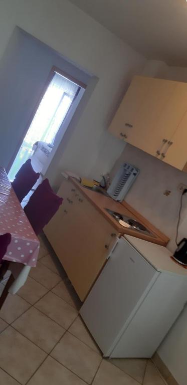 Kuchyň nebo kuchyňský kout v ubytování Apartmani Five