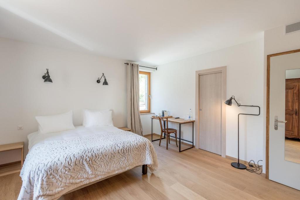 Postel nebo postele na pokoji v ubytování La Ferme du Lignon