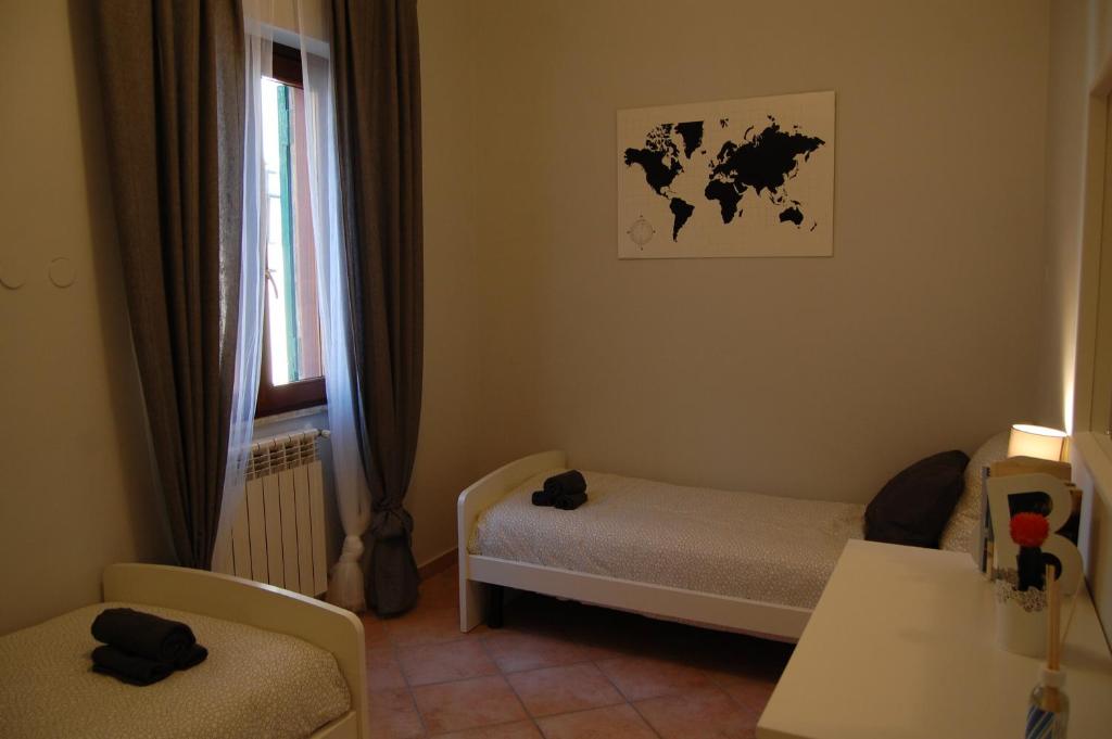 Posteľ alebo postele v izbe v ubytovaní La Loggetta sul Borgo
