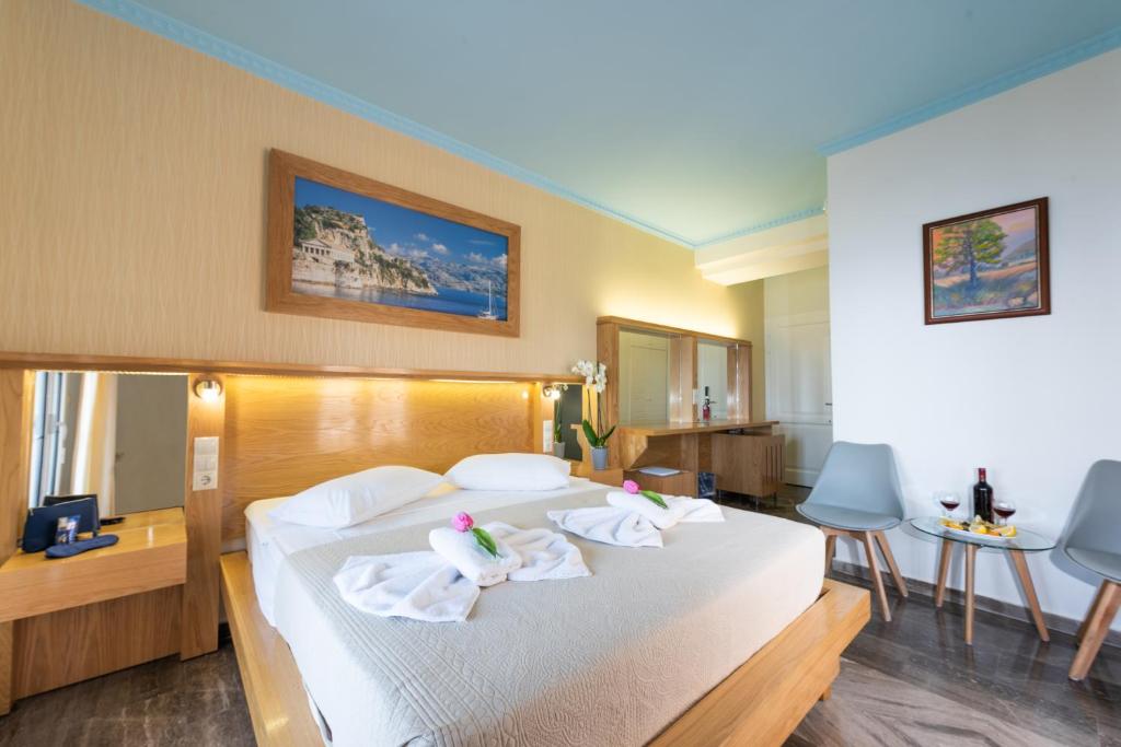 Postel nebo postele na pokoji v ubytování Lido Corfu Sun Hotel 4 Stars All-inclusive