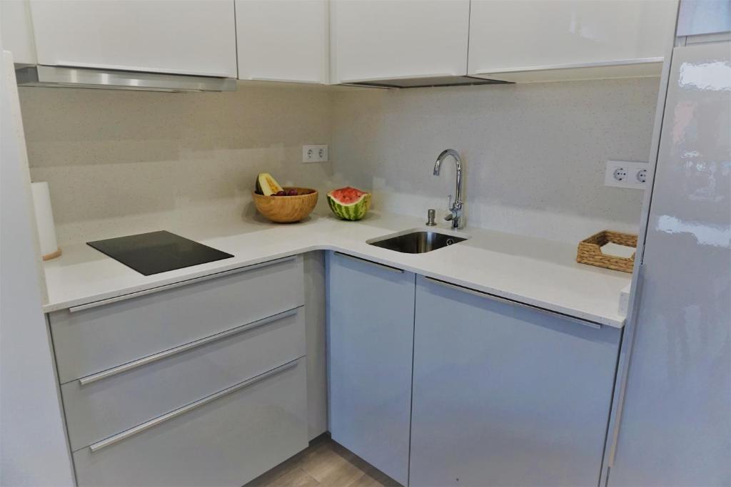 Kuchyň nebo kuchyňský kout v ubytování Apartamentos La Playina