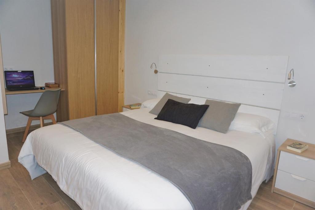 Postel nebo postele na pokoji v ubytování Apartamentos La Playina