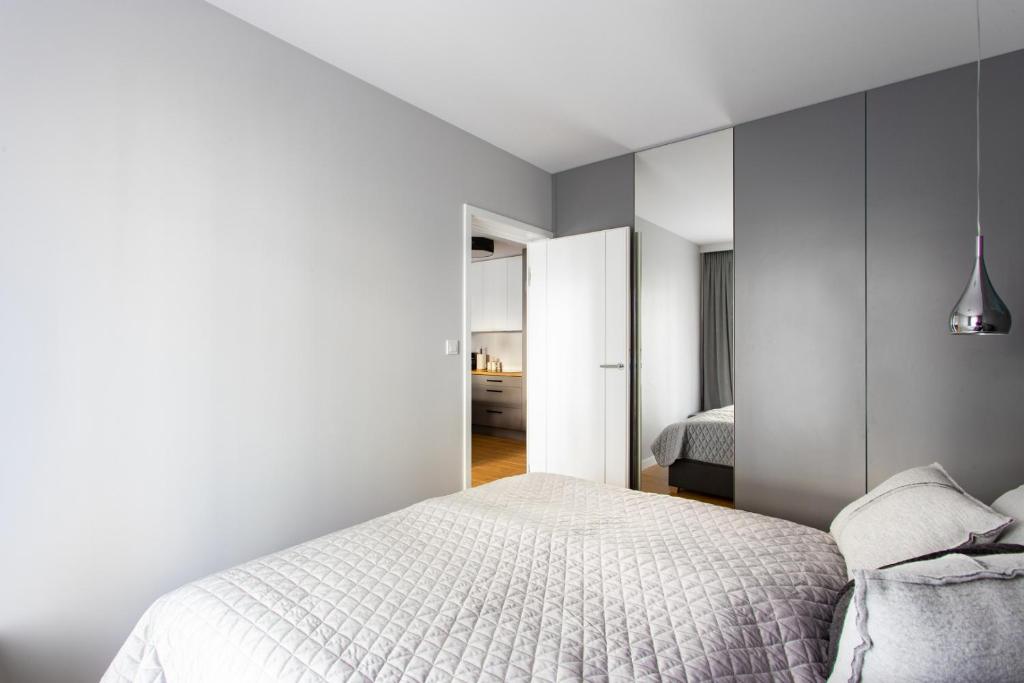 Posteľ alebo postele v izbe v ubytovaní Apartament Gardenia Sea&Sun DZIWNÓW PRZY PLAŻY