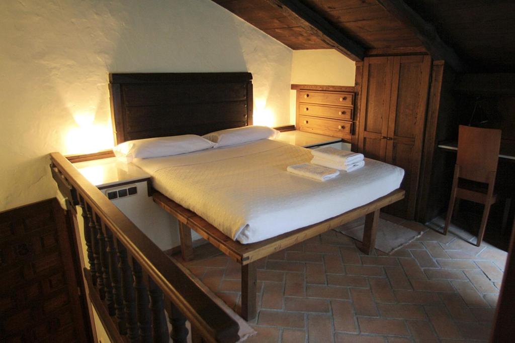 Postel nebo postele na pokoji v ubytování Hotel Rural Llerau