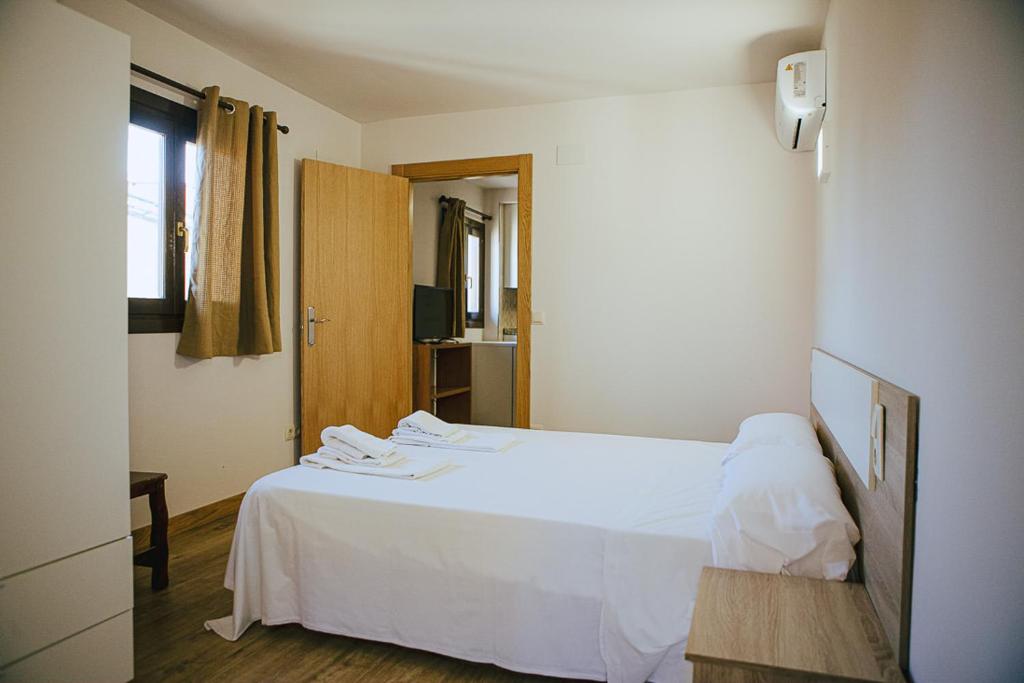 Cama o camas de una habitación en Apartamentos Ducay