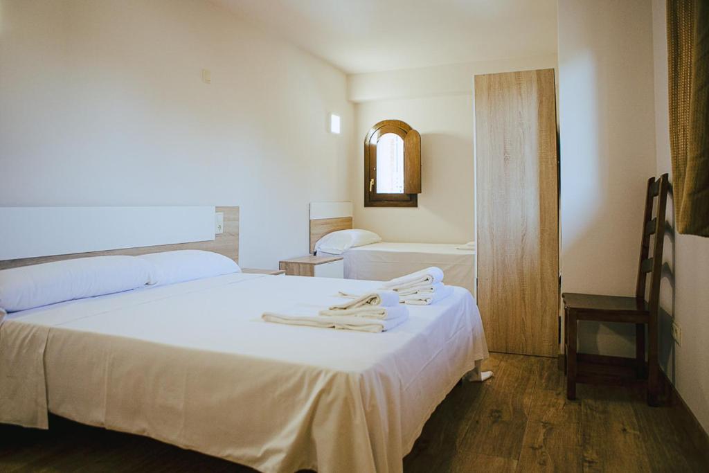 Cama o camas de una habitación en Apartamentos Ducay