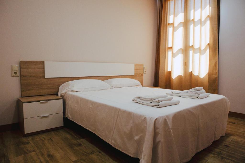 Cama o camas de una habitación en Apartamentos Ducay