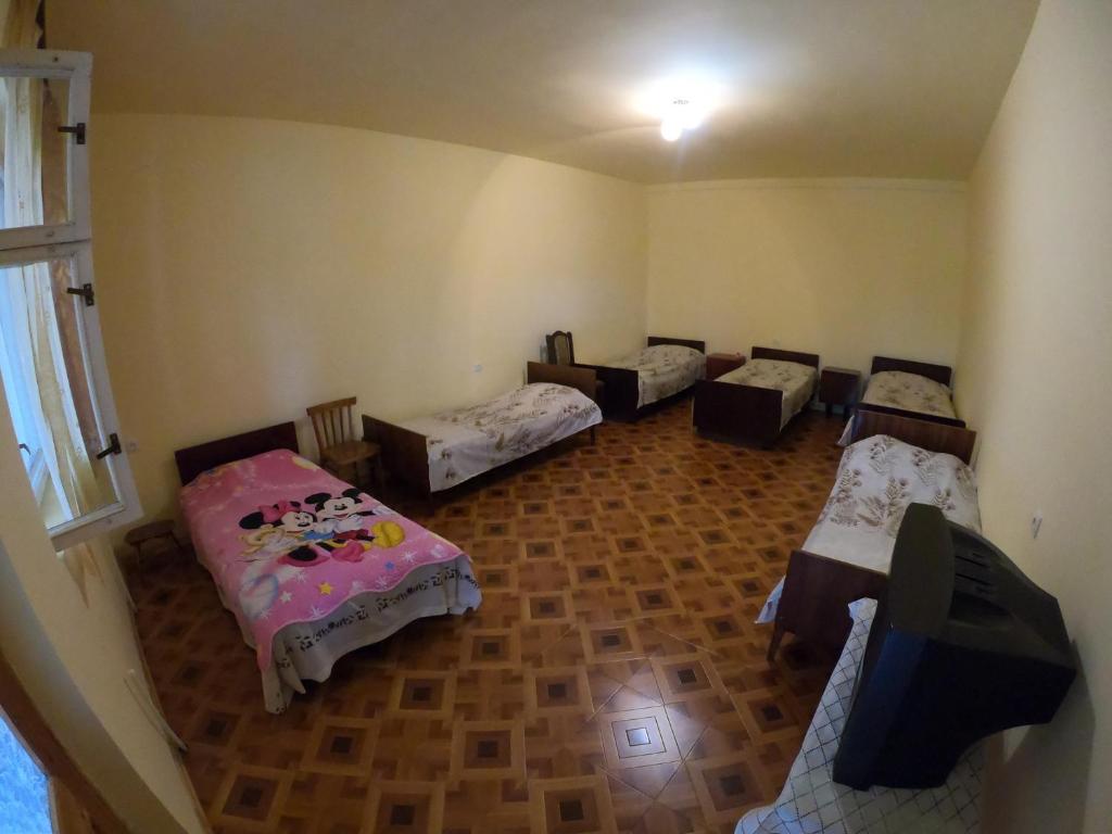 Postel nebo postele na pokoji v ubytování NNN Guest House