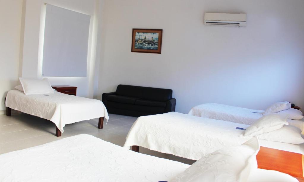 Postel nebo postele na pokoji v ubytování Hotel Dorado Plaza Centro Histórico