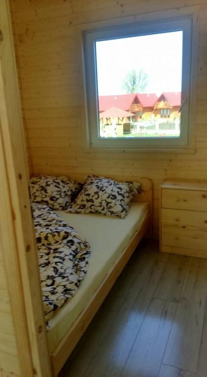 Postel nebo postele na pokoji v ubytování Domki letniskowe Na Stoku