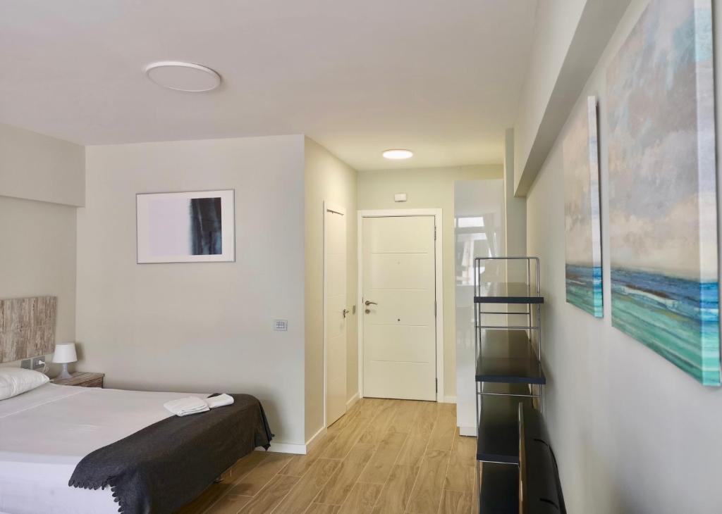 Posteľ alebo postele v izbe v ubytovaní Guajara Modern Studio