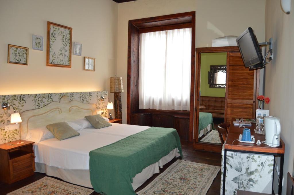 Postel nebo postele na pokoji v ubytování Gara Hotel
