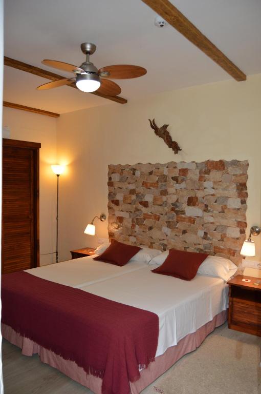 Postel nebo postele na pokoji v ubytování Gara Hotel