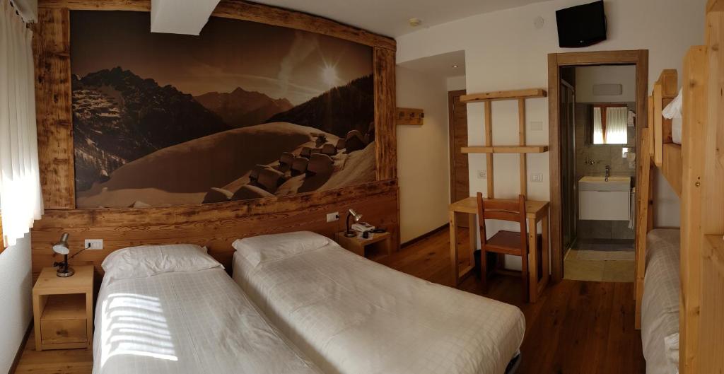 Posteľ alebo postele v izbe v ubytovaní Albergo Soldanella