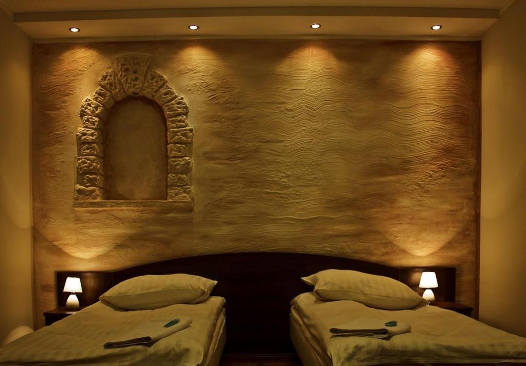 Postel nebo postele na pokoji v ubytování Hotel Pojezierze