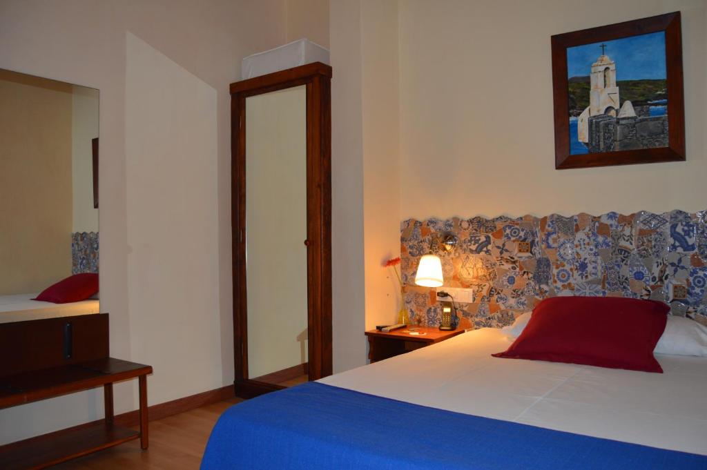 Postel nebo postele na pokoji v ubytování Gara Hotel