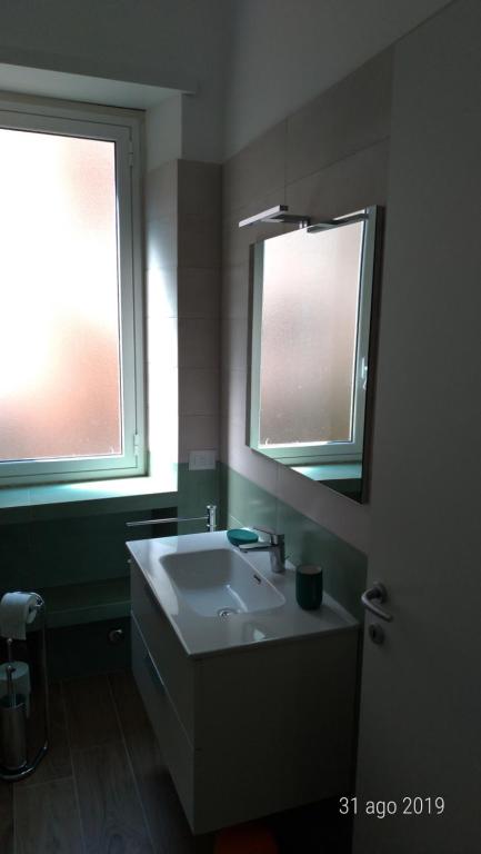 Łóżko lub łóżka w pokoju w obiekcie Casa di Rosita