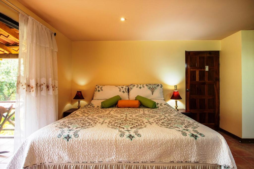 Postel nebo postele na pokoji v ubytování La Terraza Guest House B&B