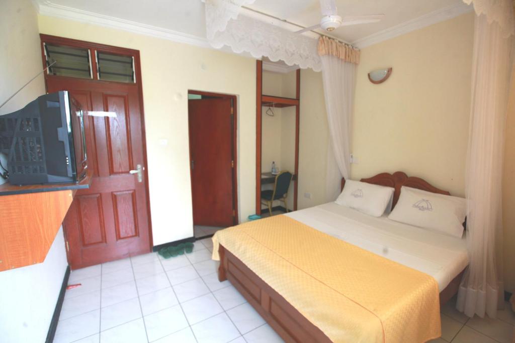 Postel nebo postele na pokoji v ubytování Coastgate Hotel