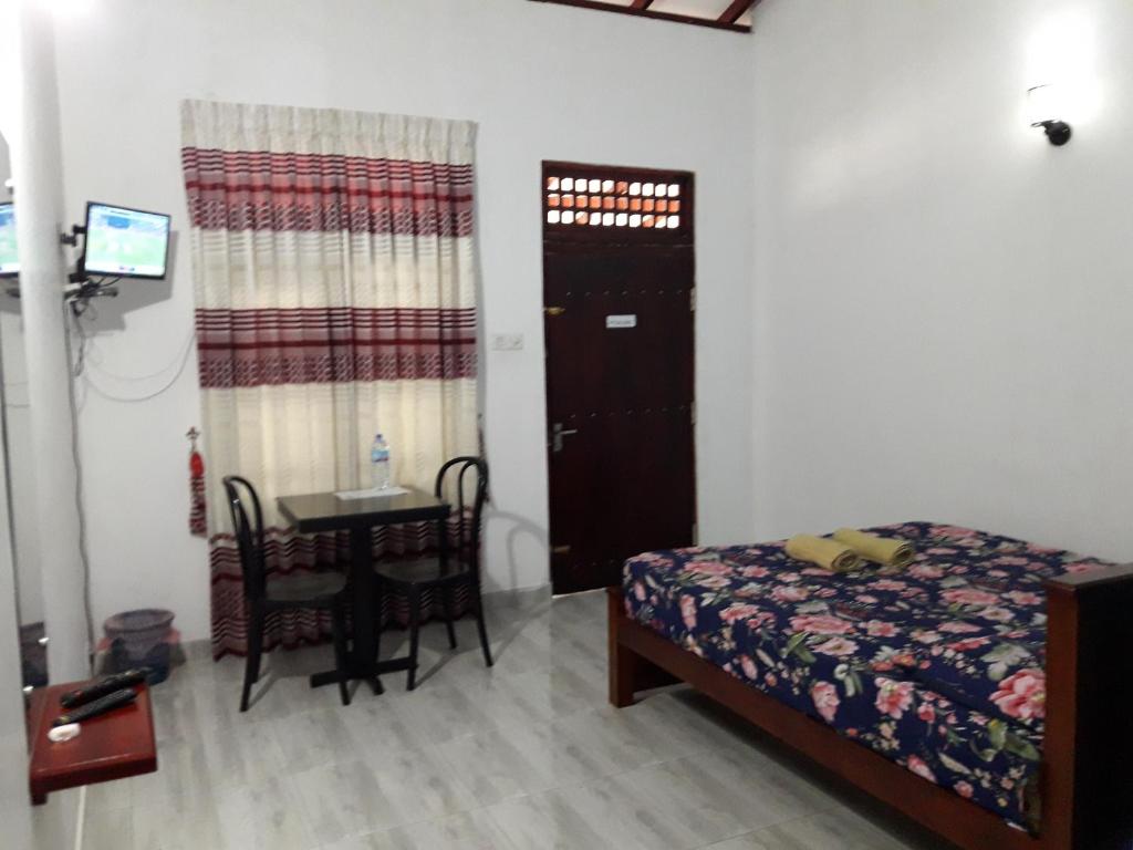 Postel nebo postele na pokoji v ubytování White Wall Hotel