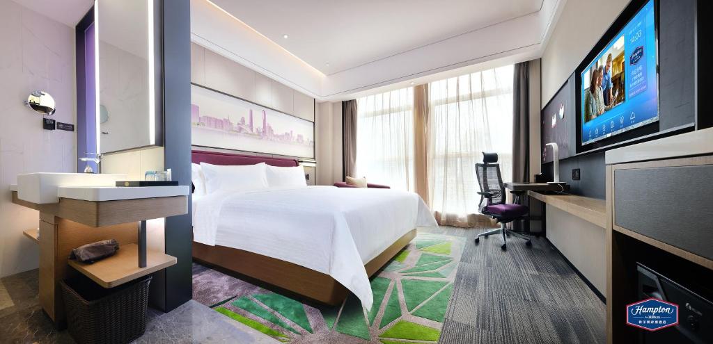 TV a/nebo společenská místnost v ubytování Hampton by Hilton Guangzhou Dongxiaonan
