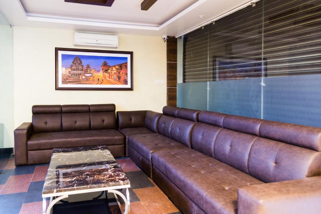 Posezení v ubytování Ganapati Airport Hotel