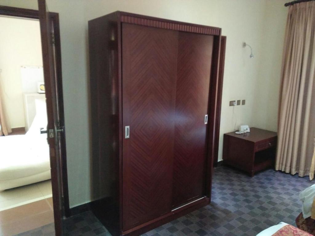 Postel nebo postele na pokoji v ubytování Falcon Heights Hotel
