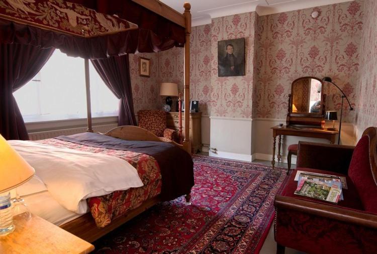 Postel nebo postele na pokoji v ubytování B&B The Baron