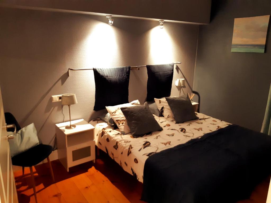 Tempat tidur dalam kamar di B&B Camp Ängra