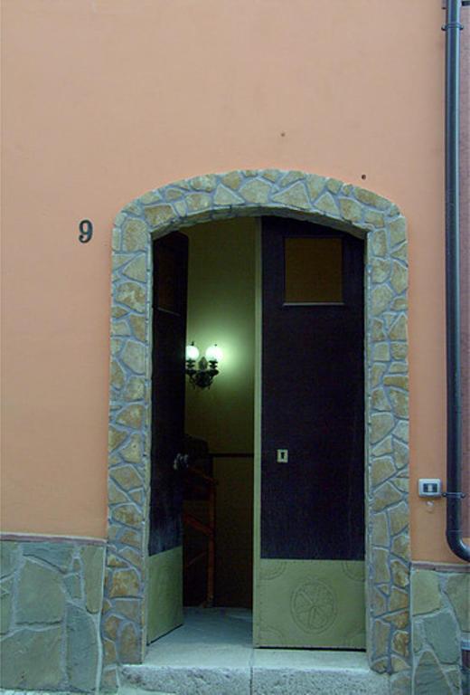 an entrance to a building with a stone doorway at La Collina di nonno Carmine in Santa Paolina