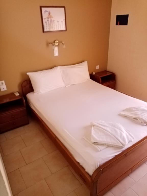Postel nebo postele na pokoji v ubytování John Apartments
