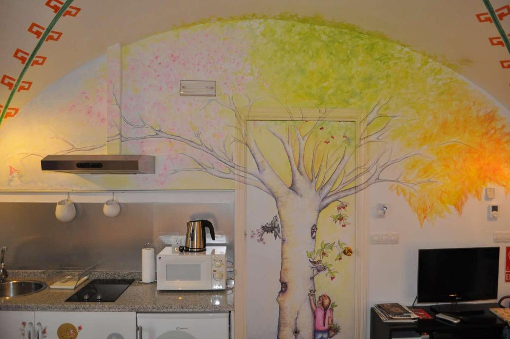 Kuchyňa alebo kuchynka v ubytovaní Apartamentos La Casa Pintada