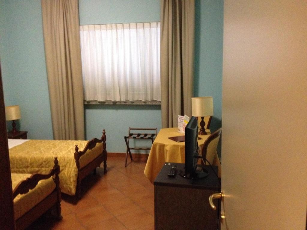 Postel nebo postele na pokoji v ubytování Hotel Nastro Azzurro