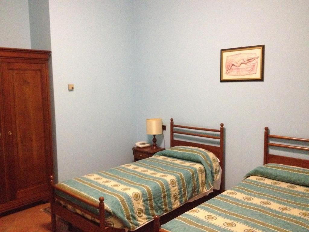 Postel nebo postele na pokoji v ubytování Hotel Nastro Azzurro