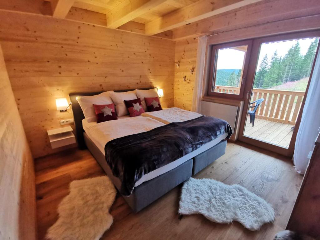 Postel nebo postele na pokoji v ubytování Berghütte Murmele