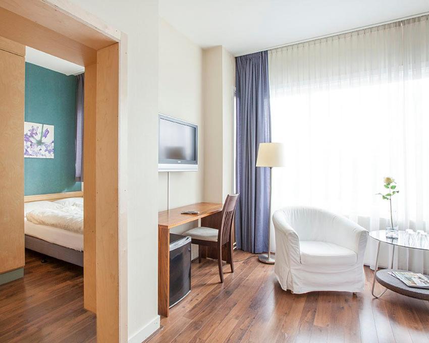 Postel nebo postele na pokoji v ubytování Hotel Gevers